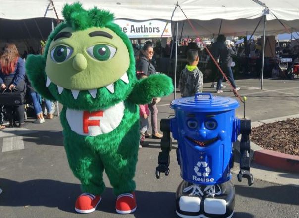 Green monster with blue waste bin robot